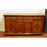 Late Victorian oak sideboard, the moulded rectangular top over three frieze drawers, panelled doors,