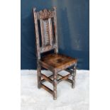 18th century oak hall chair, the floral carved top rail over vertical splat, moulded seat and raised