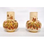 Near pair of Royal Worcester vases, each with gilt rim, cylindrical neck, pot bellied waist, on foot