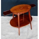 Edwardian kettle stand, the crossbanded oval top with shell inlay over opposing slides, raised on