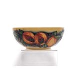Moorcroft bowl by Nicola Slaney decorated with pomegranates over beige ground, 2012, 145/150, 15cm