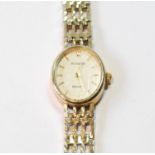 Lady's Accurist 9ct gold bracelet watch, quartz, gross 14g.