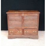 18th century oak blanket chest, the rectangular hinged top over frieze panels, two short drawers and