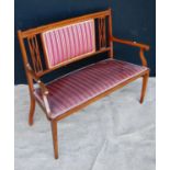 Edwardian mahogany parlour seat, the crossbanded top rail over cushioned back flanked by open