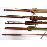 Five vintage fishing rods to include two trout rods, two salmon rods and a spinning rod.  (5)