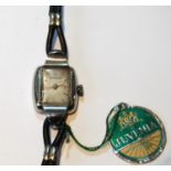 Lady's Juvenia stainless steel watch on cordette, case tag, guarantee and receipt, 1950.