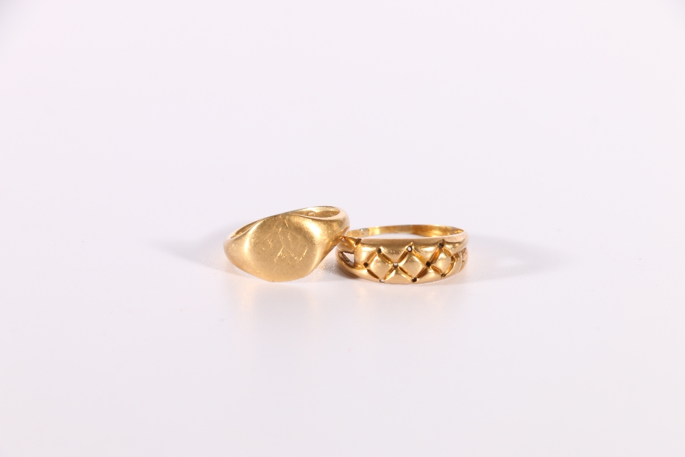 18ct gold signet ring, size I, 3.3g and an unhallmarked yellow metal ring, size N, 3.3g, (2)