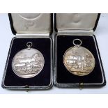 Two agricultural silver medals with farm livestock in relief, one for Westmorland & Kendal