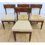 Set of four Regency mahogany dining chairs raised on turned and fluted supports