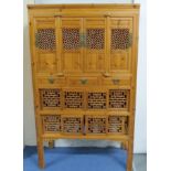 Chinese elm 'chicken coop' cabinet with pierced doors, height 183cm and width 110cm.