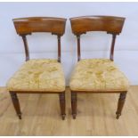 Pair of Regency mahogany dining chairs raised on turned and fluted supports