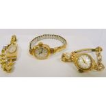 Three lady's 9ct gold watches on rolled gold bracelets.