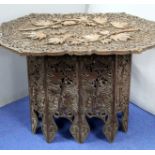 Ceylonese occasional table with elaborate floral carved top and stand, 83cm wide, 60cm high and 56cm