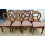 Set of twelve Victorian mahogany framed balloon back dining chairs raised on turned supports
