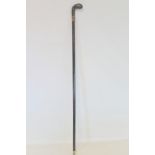 Victorian or Edwardian gentleman's ebonised walking cane with pistol grip horn handle and gilt metal