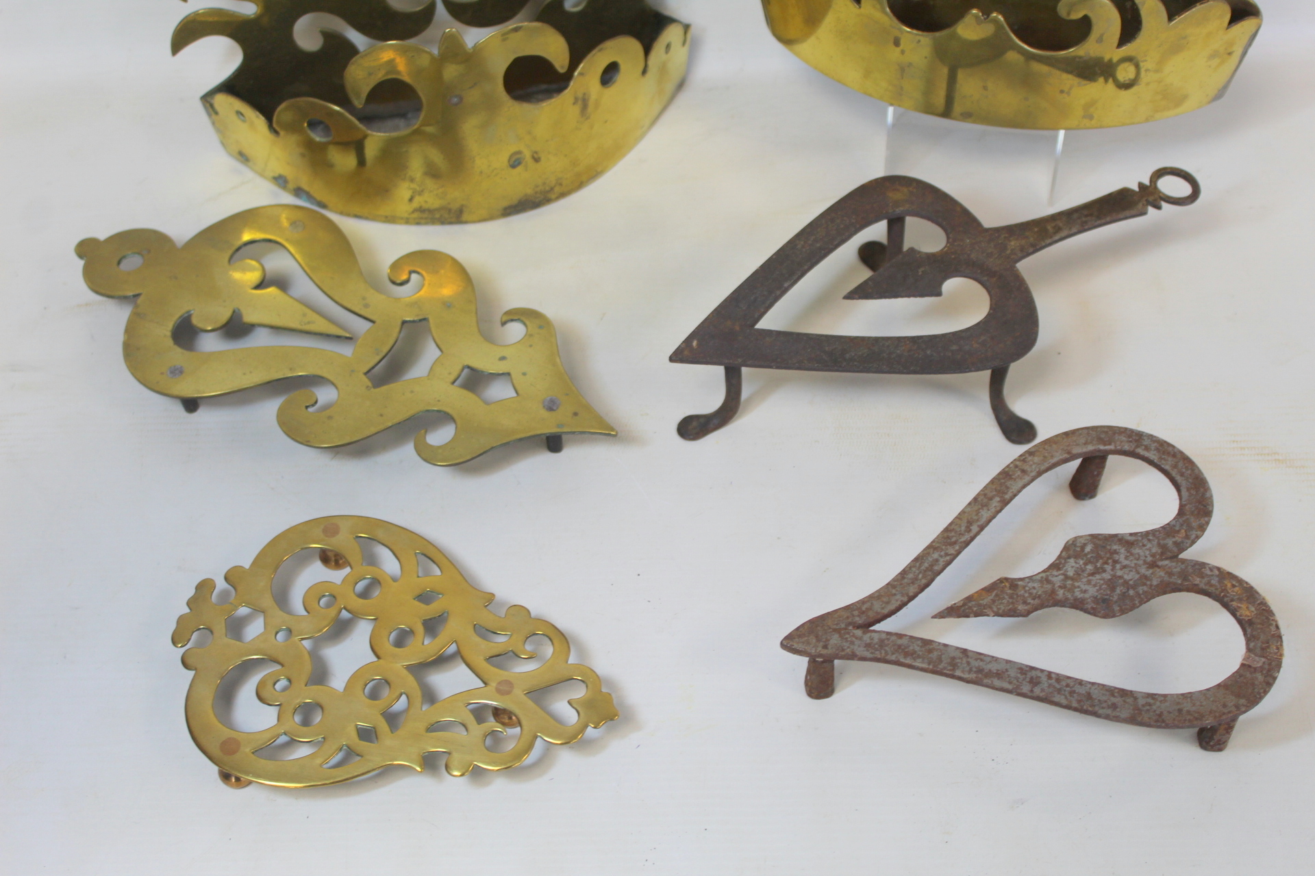 Two Victorian brass half ornaments with pierced scrolled decoration; two brass trivets of pierced - Image 3 of 6