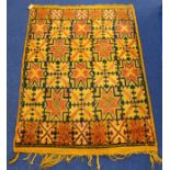 Eastern wool on cotton rug with geometric star and hooked motifs in yellow ochre, red and black,