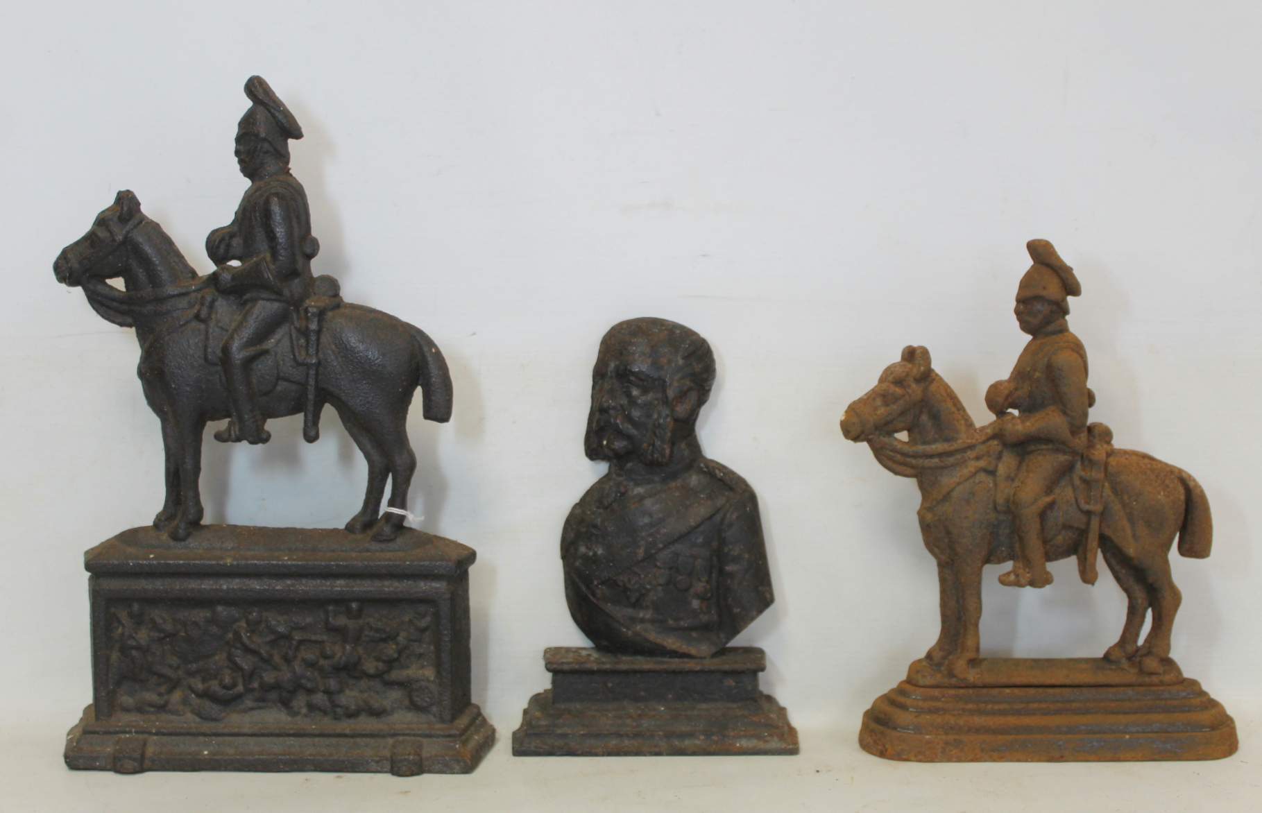 Two Victorian cast iron doorstops in the form of Crimean officers on horseback, 34cm and 26.5cm