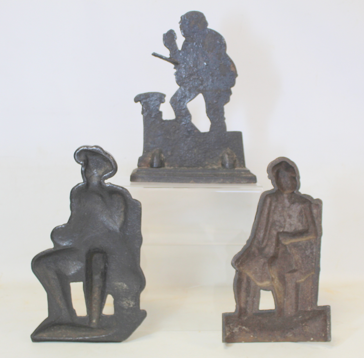 Pair of Victorian black painted cast iron doorstops or half ornaments depicting two seated men - Image 2 of 2