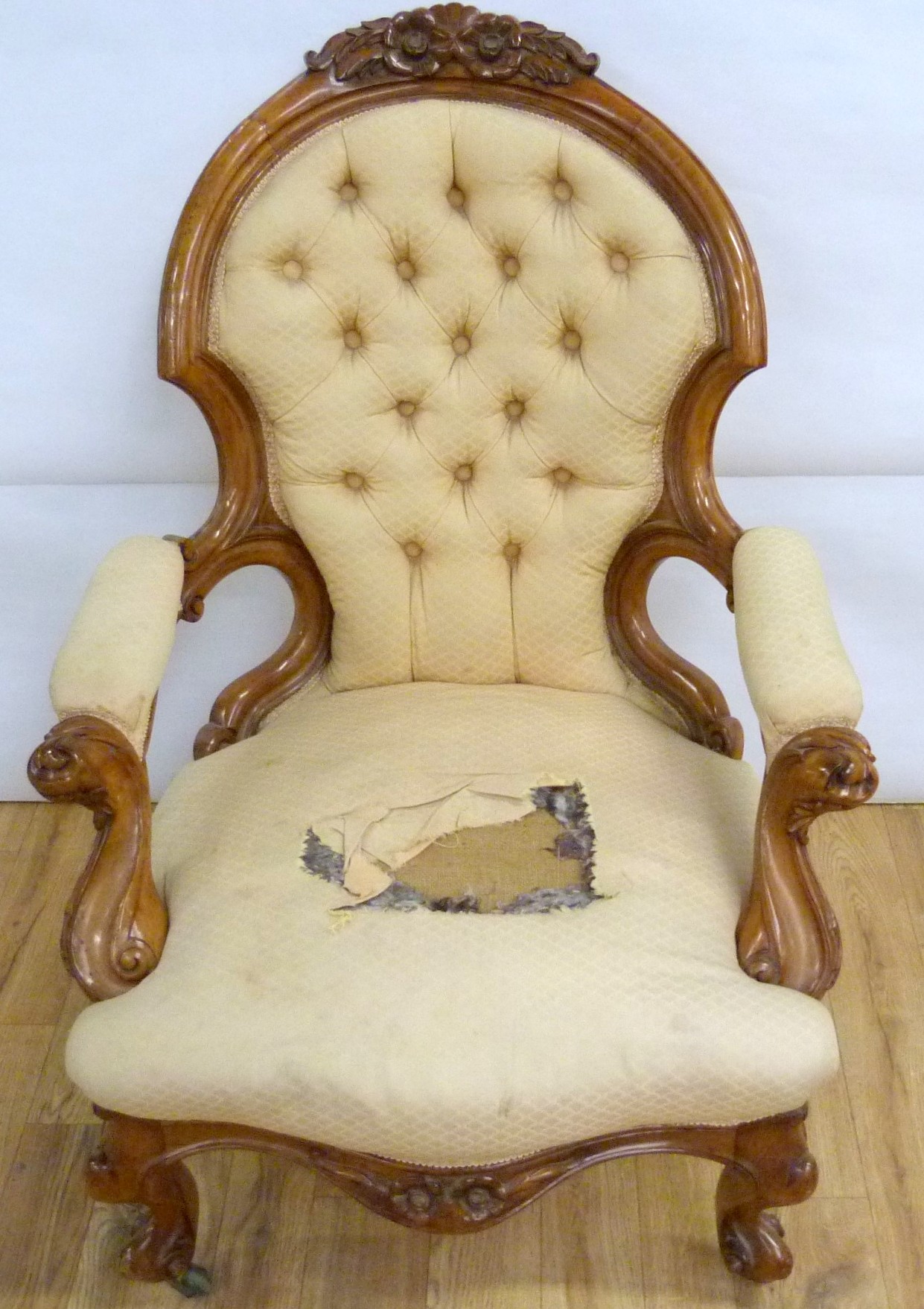 Victorian walnut framed ladies chair with floral carved toprail, upholstered button back and seat