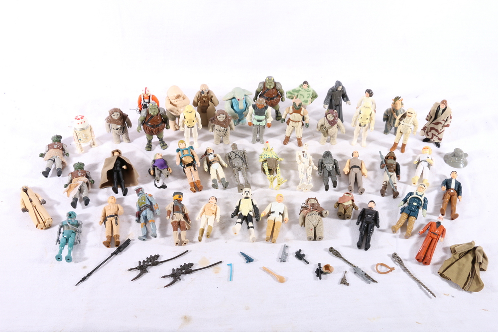 Star Wars figures including Princess Lea (1977), Ewok (1983), Luke Skywalker (1977), Emperor