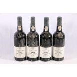Four bottles of TAYLOR'S 1985 vintage port, bottled in Oporto in 1987 and imported for Taylor,