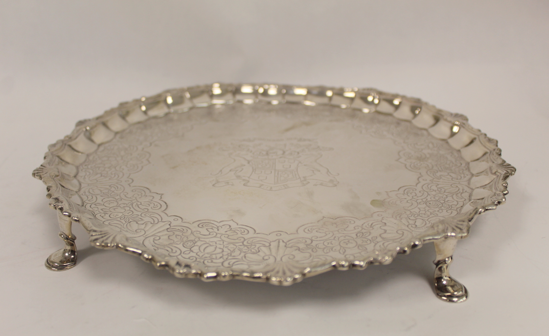 Silver circular tray with shaped moulded and scallop border, embossed with scrolls, flowers and - Image 3 of 4