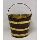 Small Georgian mahogany brass bound bucket of eliptical form with removable brass liner, 25cm wide.