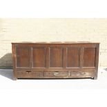 Antique oak five panel coffer with three drawers bearing later inscription "T.S.G 1713". Height