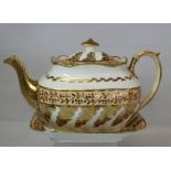 Early 19th century English porcelain teapot and matching stand or spoon tray of fluted oblong shape,