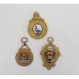 Two 9ct gold and enamel football medals "Whitehaven Rec F.C., another pigeons. 27g gross.