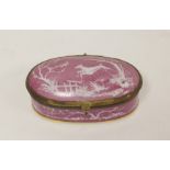 19th century Continental porcelain oval patch box with brass mounts, the mottled puce ground with