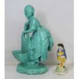 Late 18th/early 19th century Continental porcelain figure of a lady leaning on a basket with all