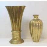 Antique brass vase of reeded ovoid form with concave rim, lacking base, 23cm high and an Art Deco