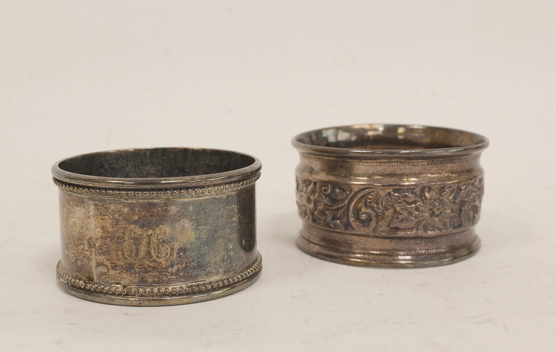 Two French silver napkin rings with engraved leafage inscribed and dated 1877 and another two - Image 3 of 4