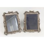 Pair of silver photograph frames with scroll border. 1990 13.5cm x 9.5cm aperture