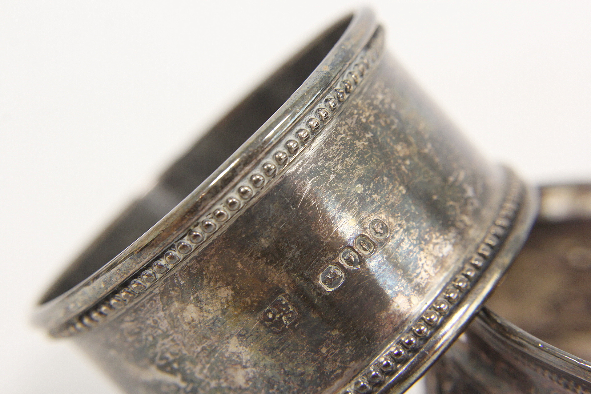 Two French silver napkin rings with engraved leafage inscribed and dated 1877 and another two - Image 4 of 4