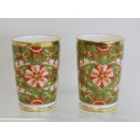 Pair of Victorian Derby spill vases of flared form with floral decoration in iron red, green and
