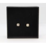 Pair of 18ct rose gold claw set solitaire diamond studs. 058ct, boxed