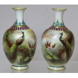 Pair of Royal Worcester Hadley Ware small porcelain vases of baluster form decorated with peacocks