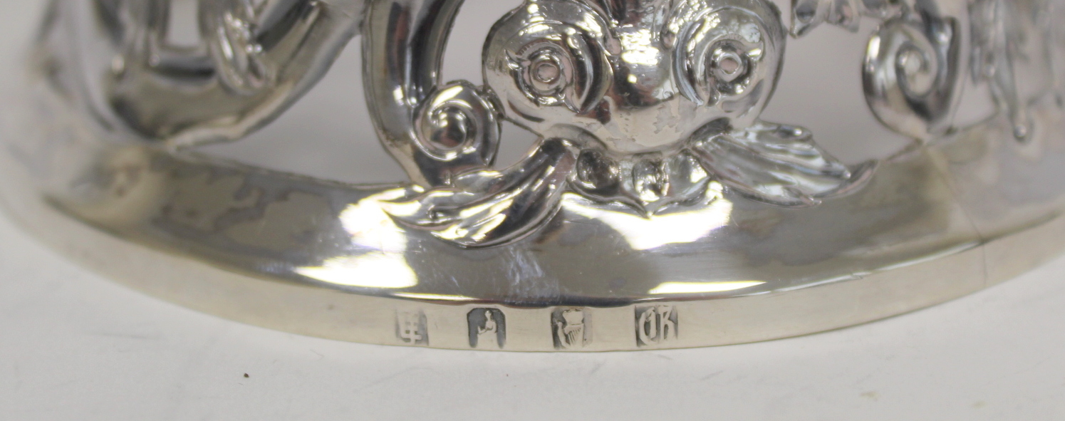 Small Irish silver 'potato ring' embossed and pierced with a bird, dolphin, scrolls and flowers, - Image 3 of 3