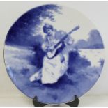 Royal Doulton blue and white circular pottery wall plaque, the hand painted decoration depicting a