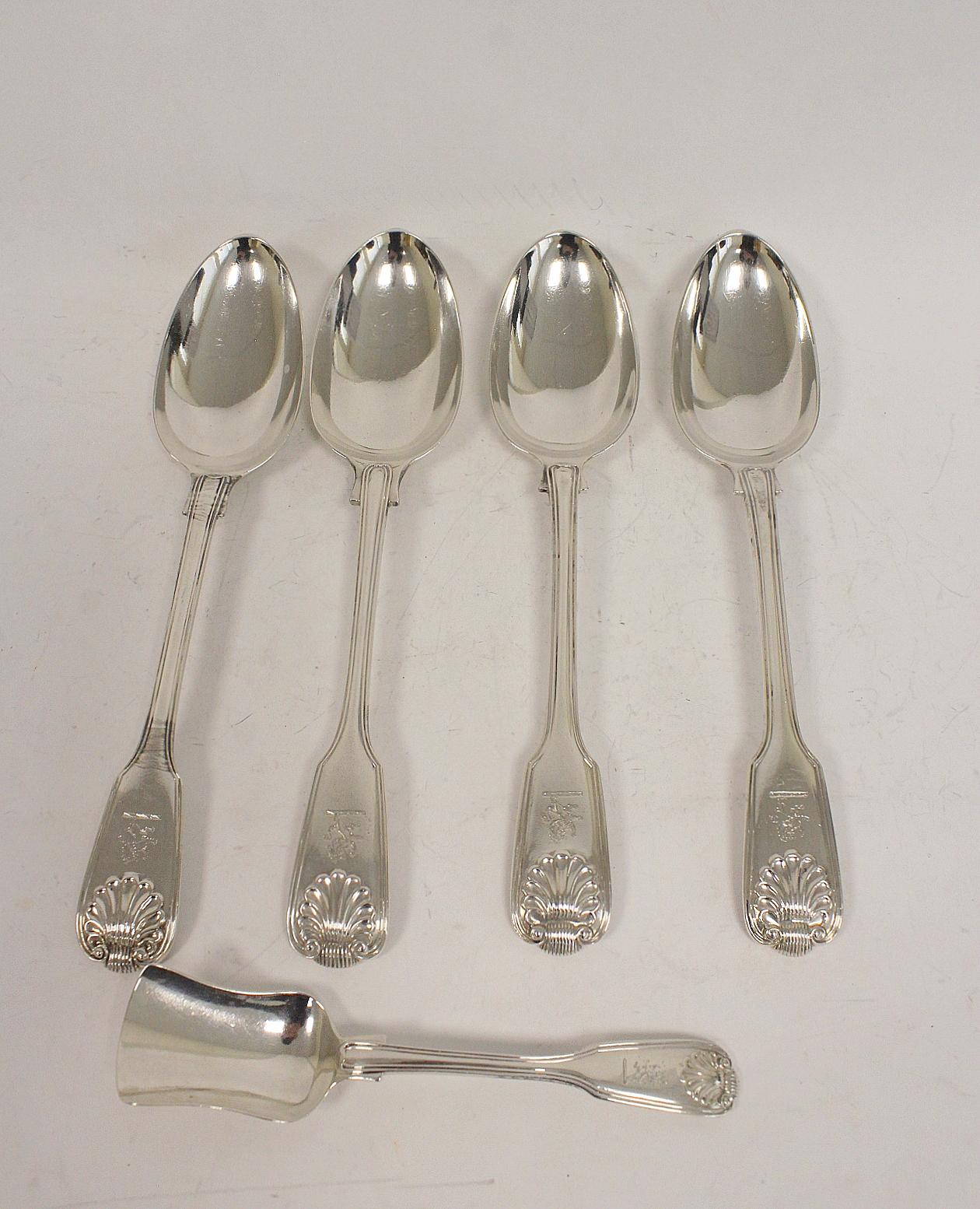 Four silver tablespoons, fiddle, thread and shell 1830/1863 and a similar jam spoon 14oz 440g.