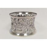Small Irish silver 'potato ring' embossed and pierced with a bird, dolphin, scrolls and flowers,