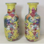 Pair of Oriental porcelain vases with polychrome decoration depicting warriors on horseback on a