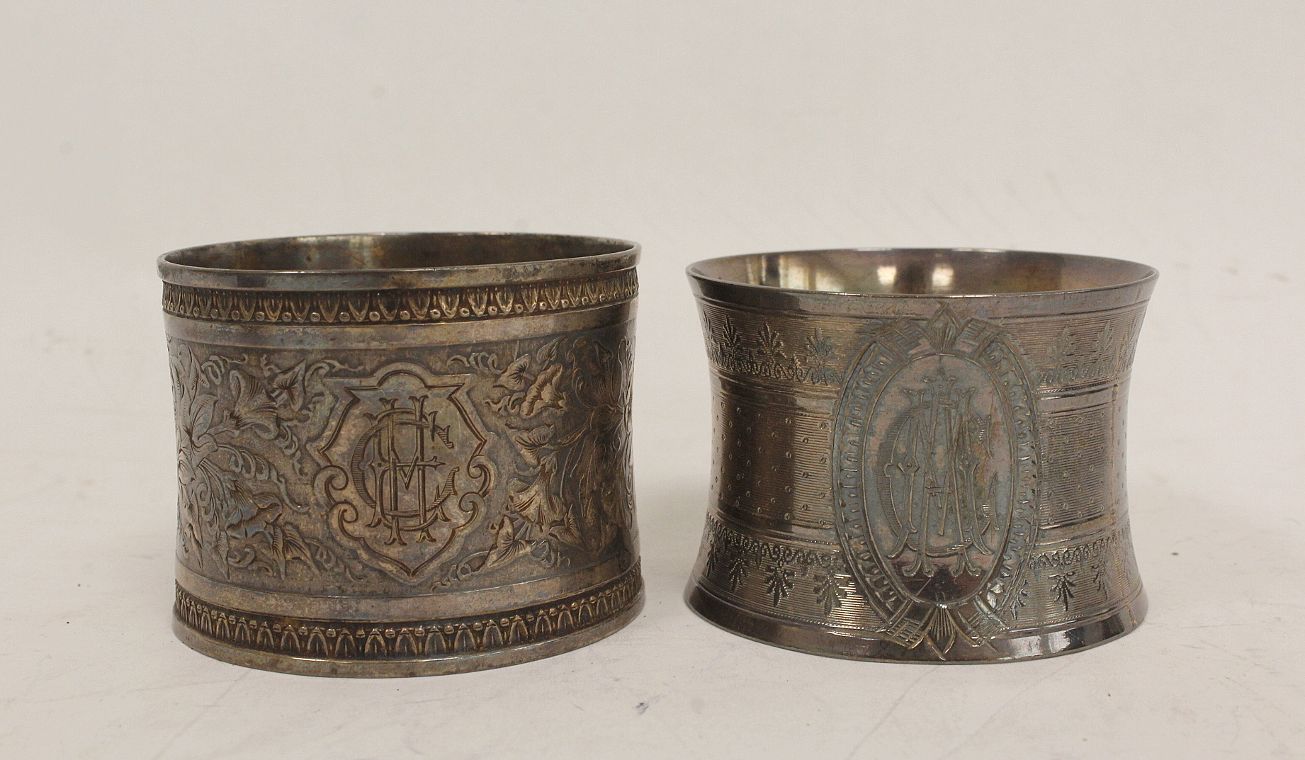 Two French silver napkin rings with engraved leafage inscribed and dated 1877 and another two - Image 2 of 4