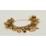 9ct gold double curb bracelet with various charms. 55g gross.