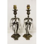 Pair of 19th century Empire style cast metal candlesticks, the baluster sconces with drooping palm