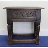 Antique rectangular carved joint stool/box raised on turned supports with understretchers. 46cm x