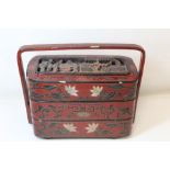 Chinese lacquer three tier calligraphy box of rounded rectangular form, with fixed strap handle,